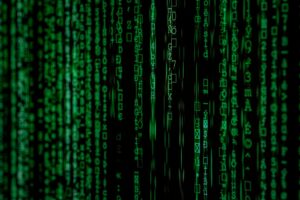 Abstract green matrix code background with binary style.